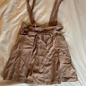 Skirt with strap detail and tie. Size M.